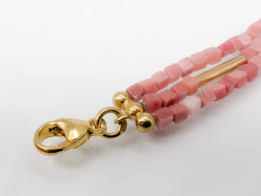 rhodoniet armband met geelgouden accenten