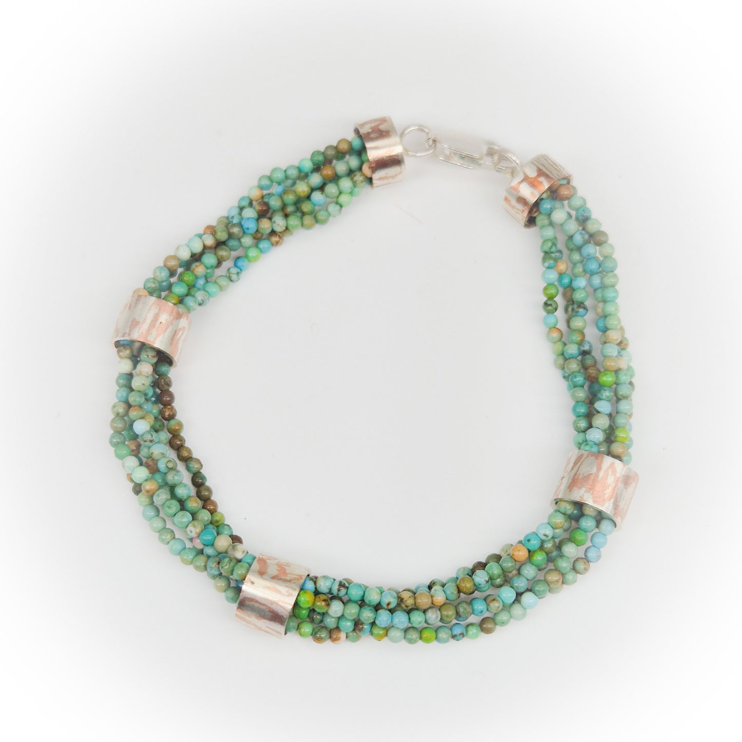 Chrysocolla armband met mokume-gane ringen